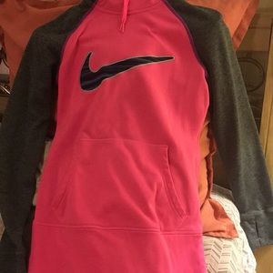 A hot pink nike sweater